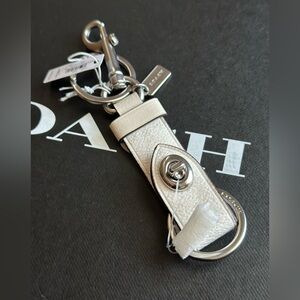 Coach Cream Leather Turnlock Keychain with Silver Hardware